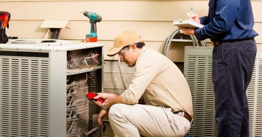 HVAC technician work on home unit