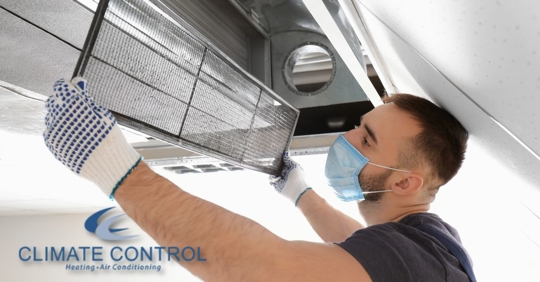 Man installing air filter