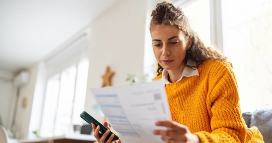 Woman checking energy bills